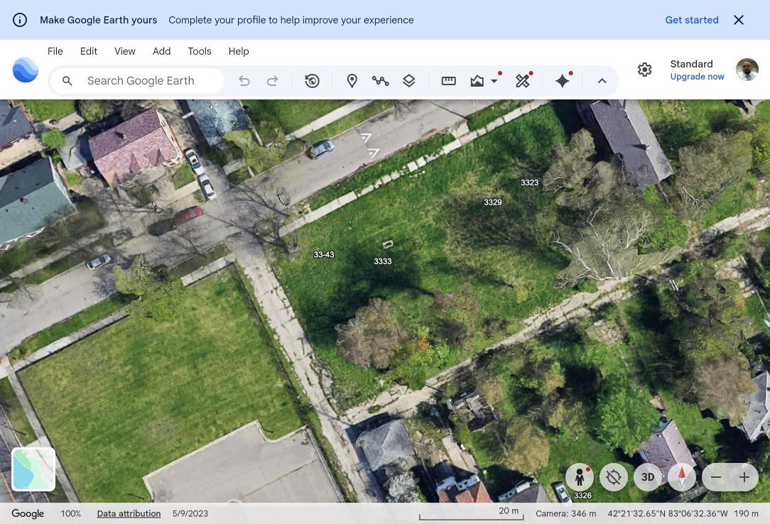 Close-up aerial view of the four Northwestern lots — 3343, 3333, 3329, and 3323 — with the alley running behind them
